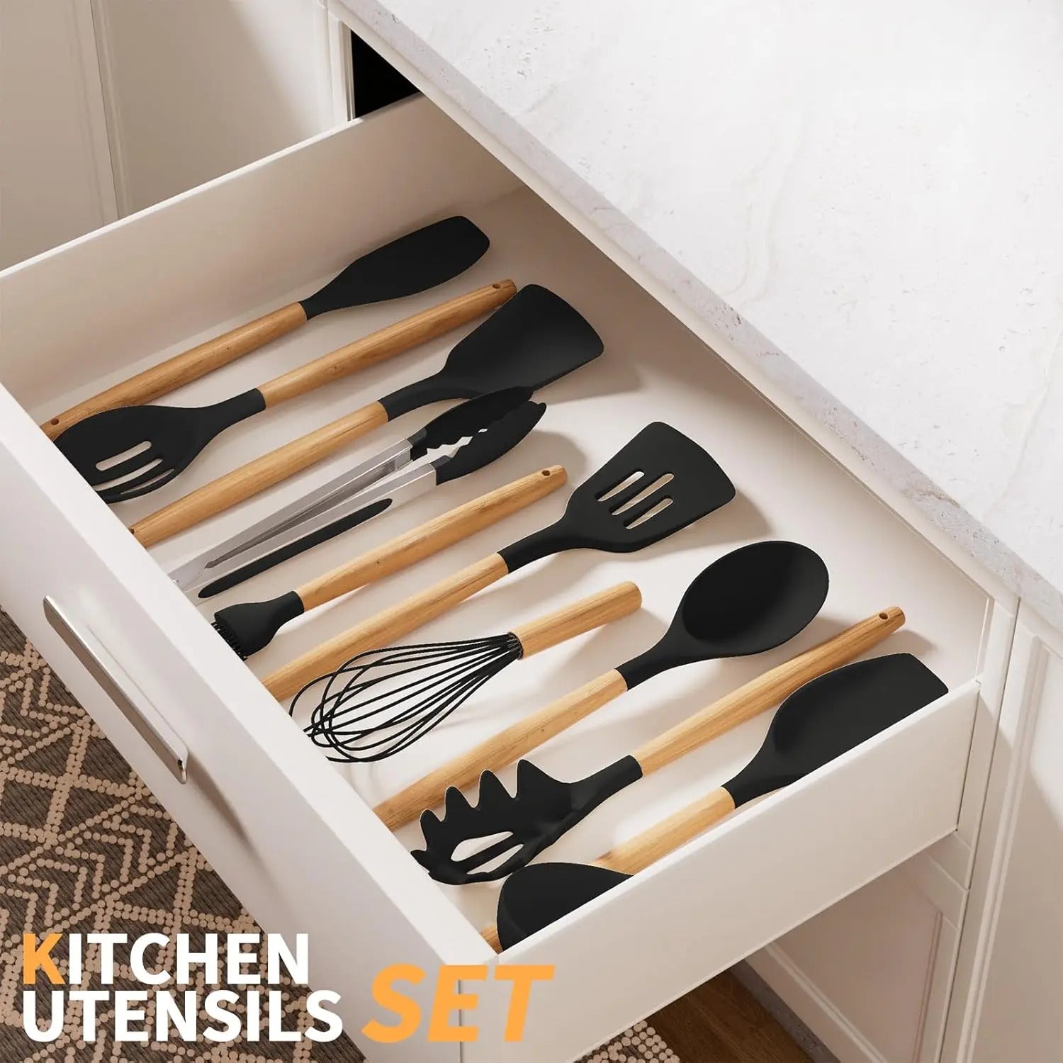 A twelve-piece kitchen tool set, including black spoons, spatulas, whisks, and tongs, is kept in the kitchen drawer.